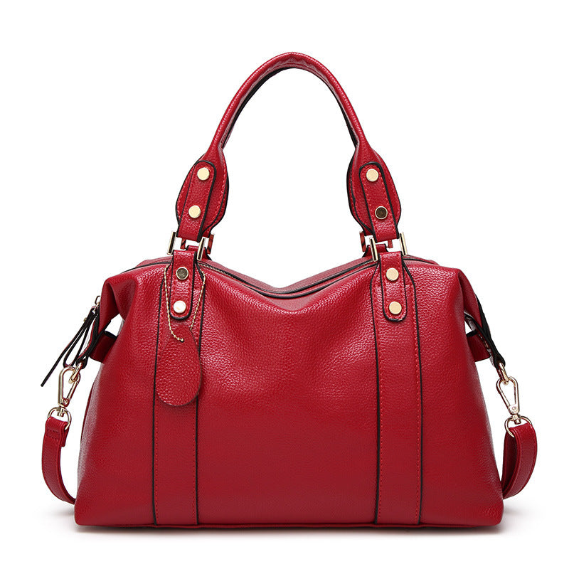 Front view of the women's fashion top handle shoulder handbag set on a neutral background