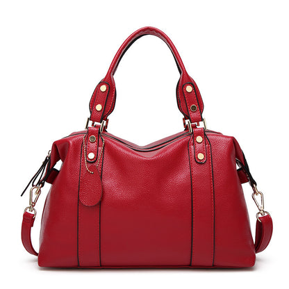 Front view of the women's fashion top handle shoulder handbag set on a neutral background